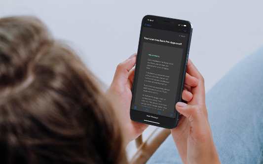 A woman using a smart mobile device to read a preapproval letter email from a knowledgeable mortgage lender.