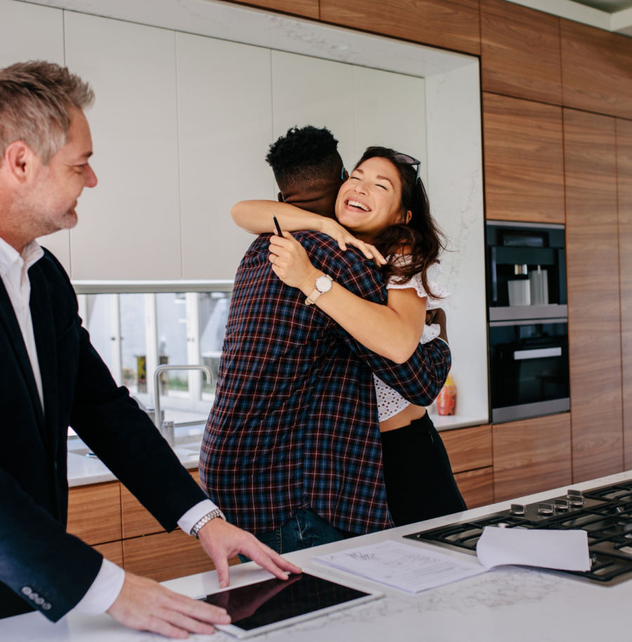 Realtor and couple getting winning bid with a cash offer loan.
